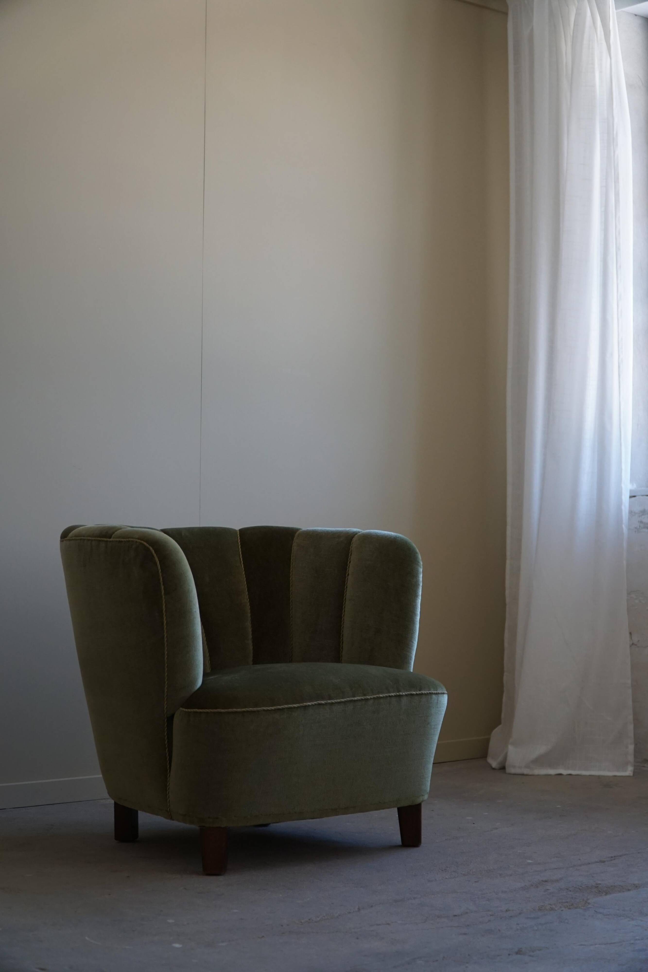 Curved Danish club chair from the mid-century, in the style of Viggo Boesen, 1940s.