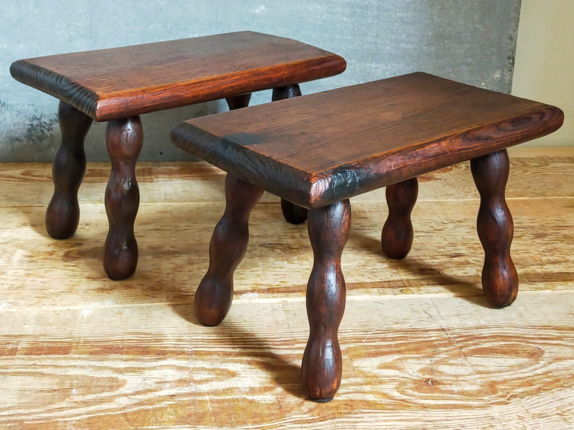 Pair of vintage solid turned wood footstools