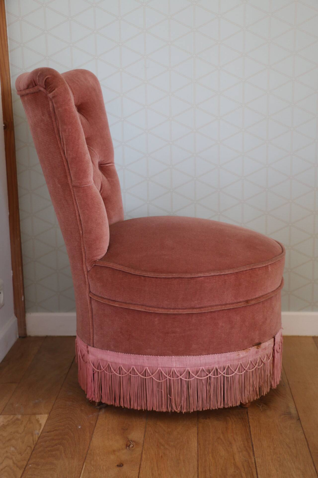 Powder pink fireside chair with fringes