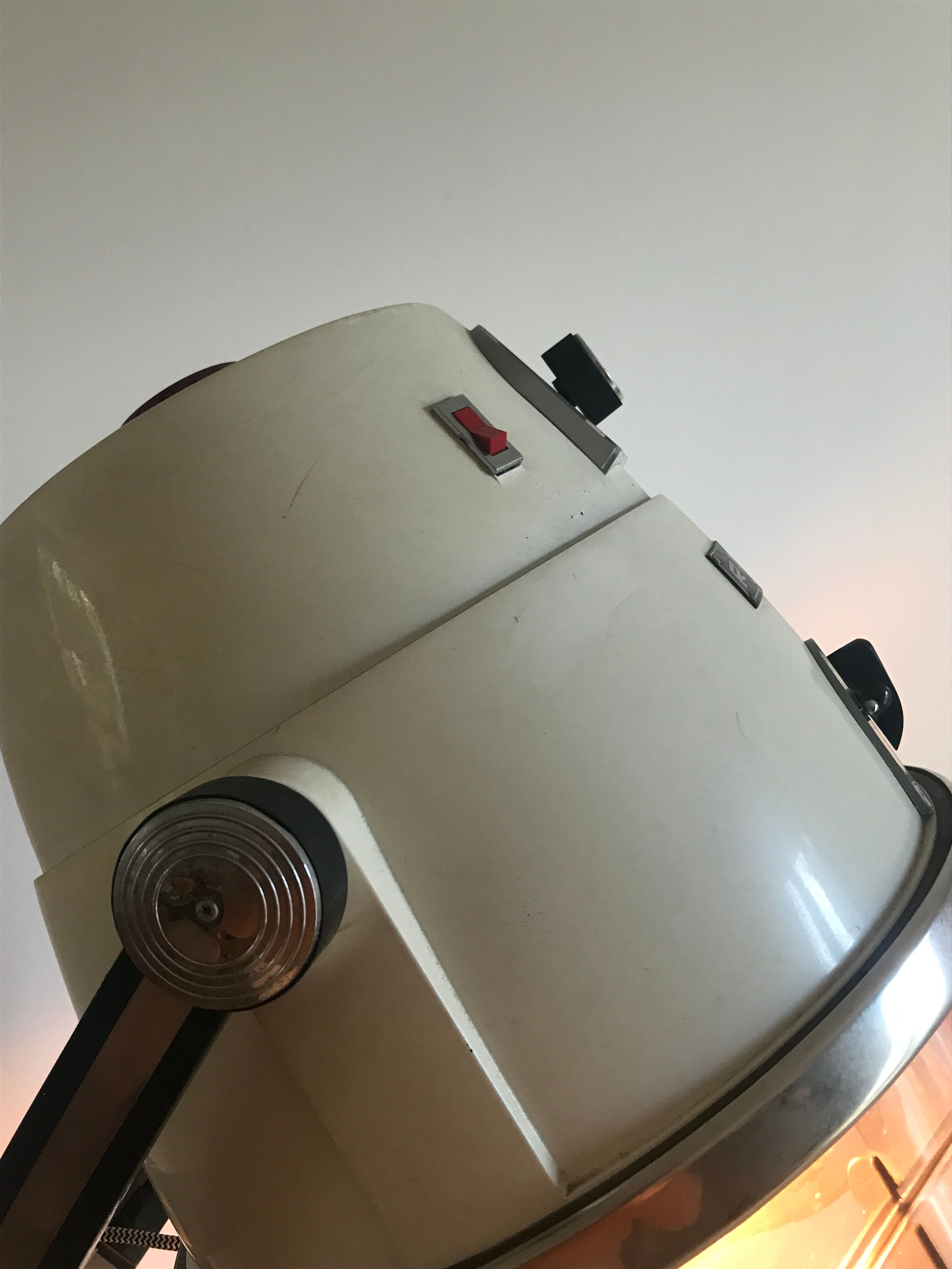 Vintage hairdresser's armchair with helmet transformed into a lamp