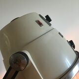 Vintage hairdresser's armchair with helmet transformed into a lamp