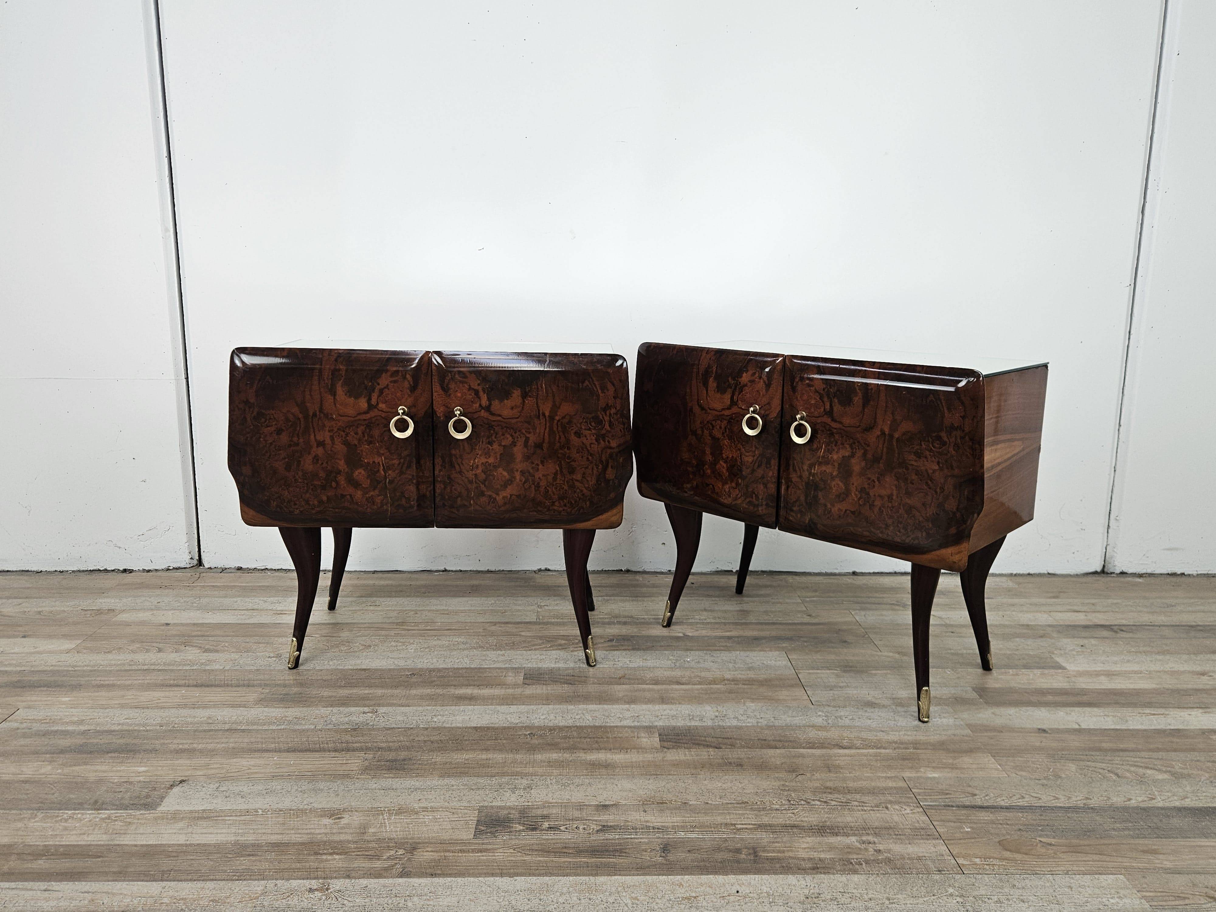 Mid-century mahogany bedside tables with mirrored tops.