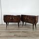 Mid-century mahogany bedside tables with mirrored tops.