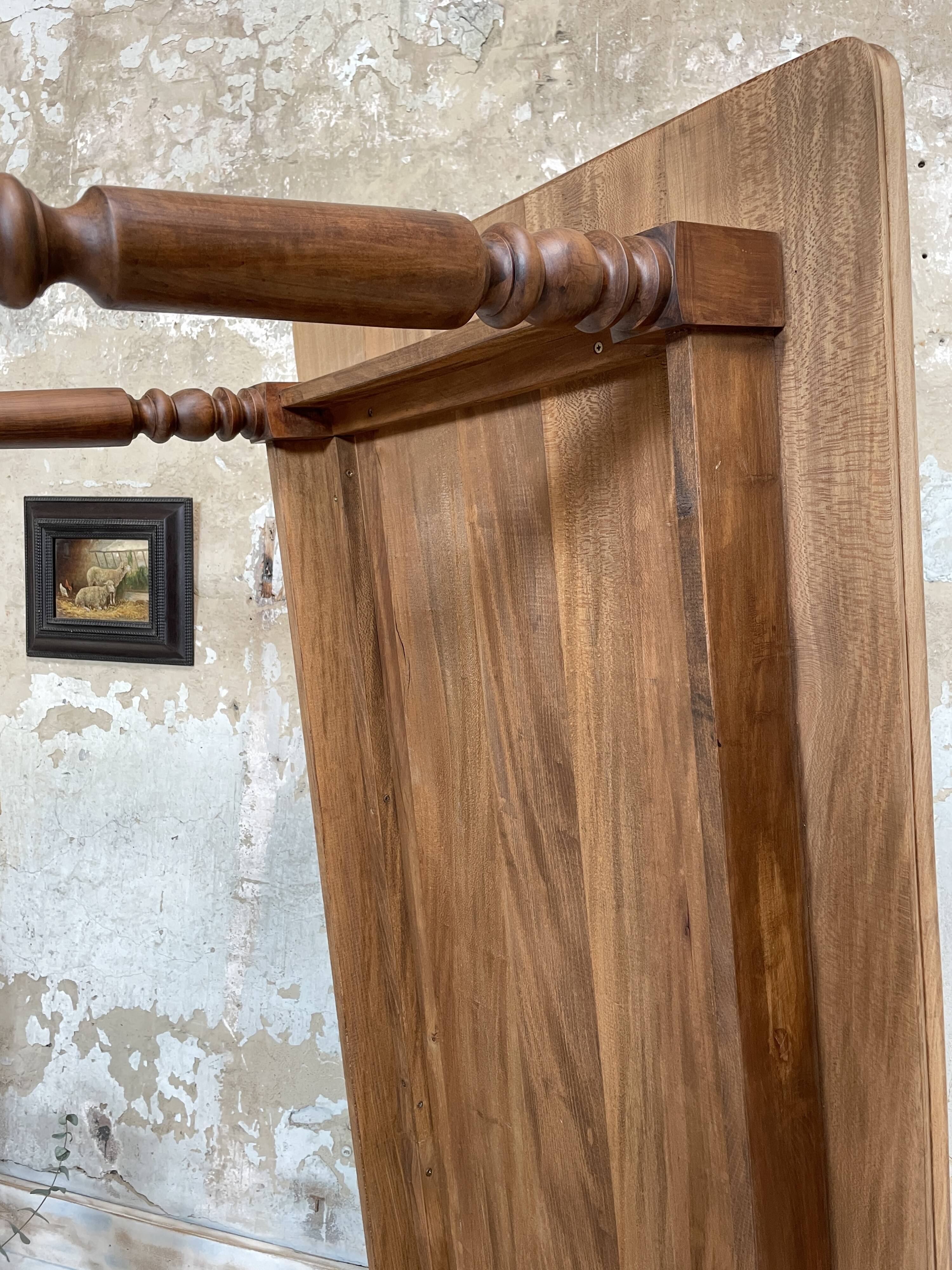 Vintage farmhouse table with turned legs.
