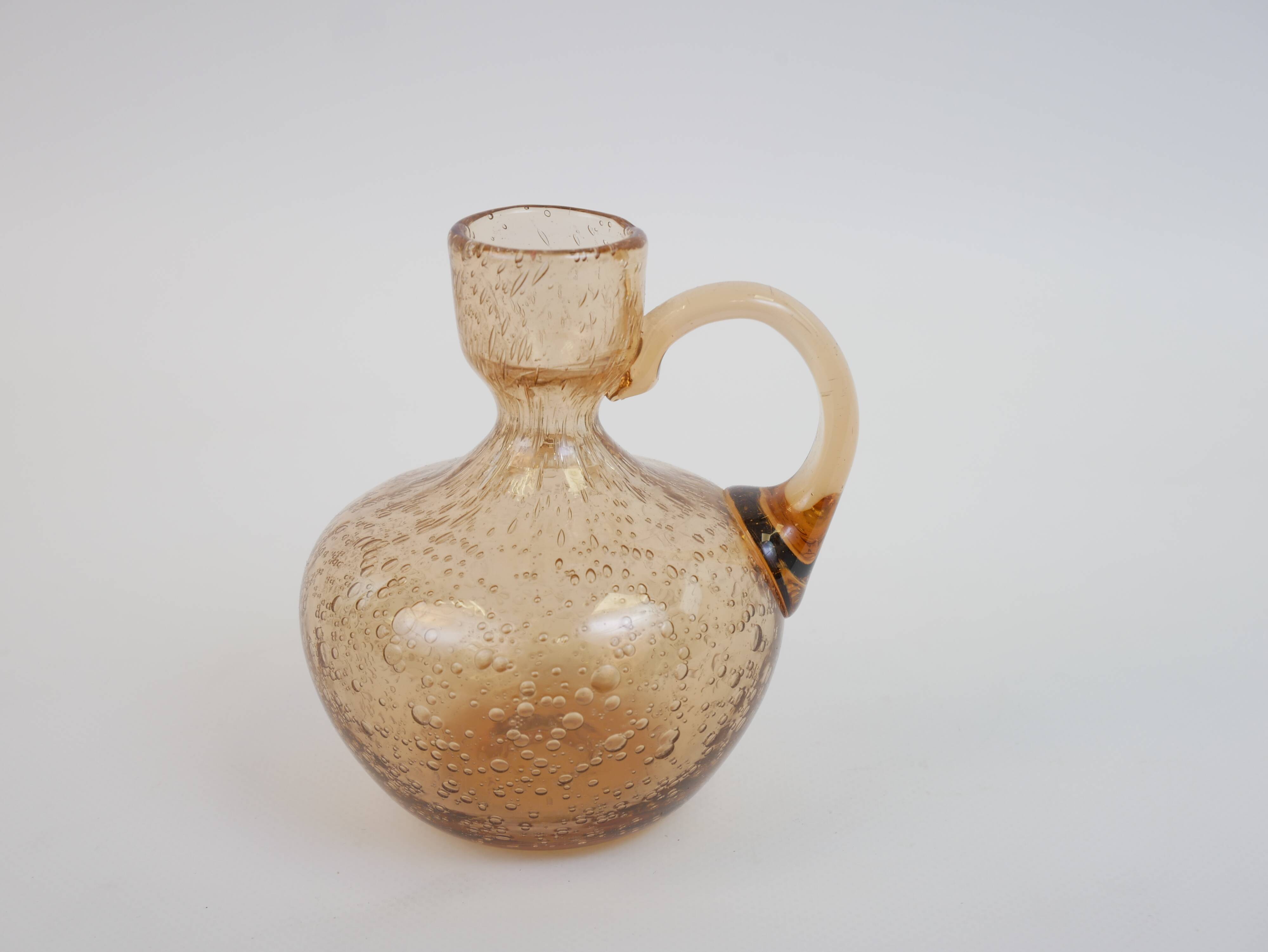Petit porte bougie en verre bullé rose de Biot