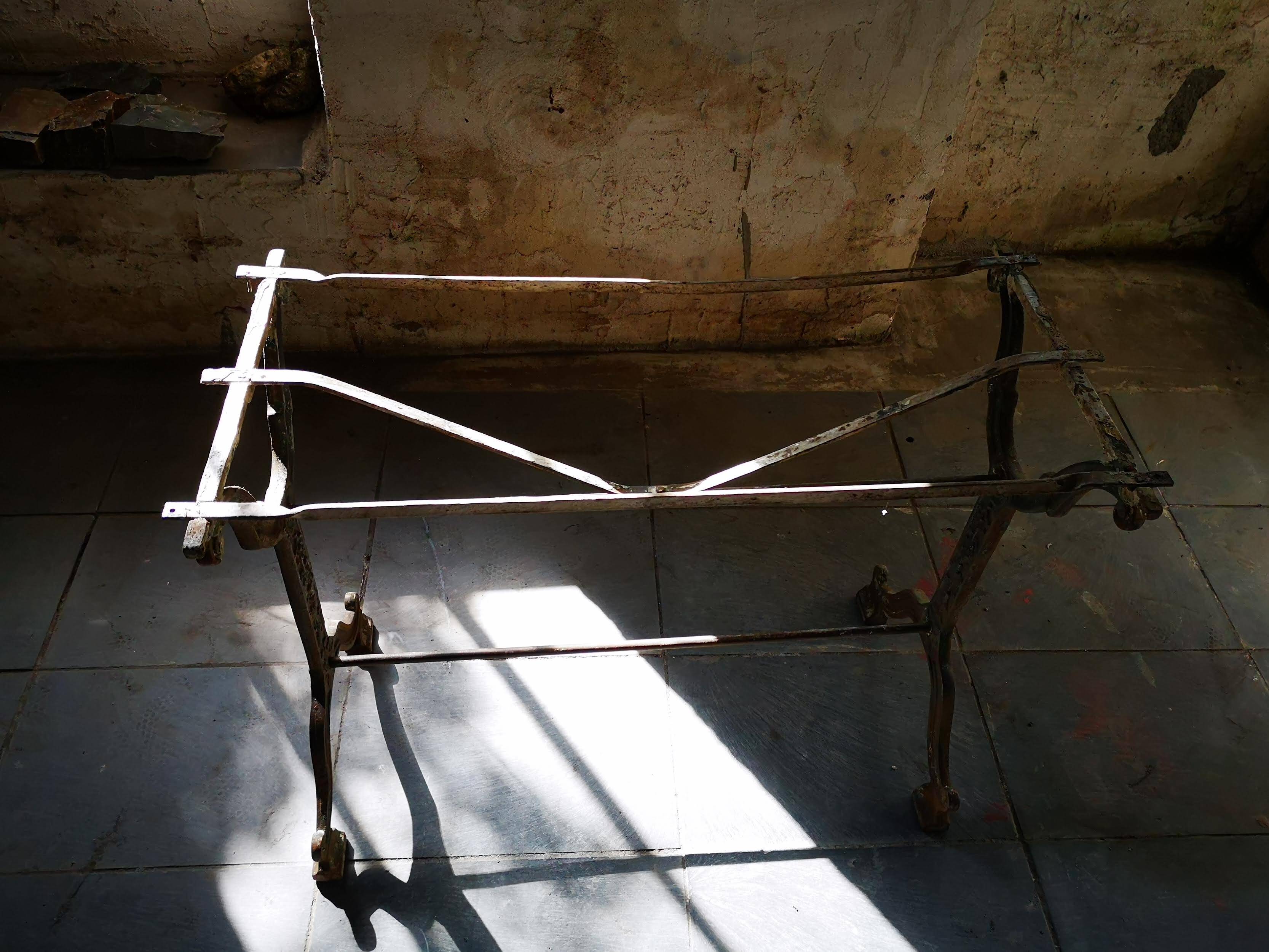 Old bistro table – cast iron legs and natural slate top