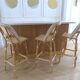 Lot of 3 Maison Louis Drucker light Manila rattan bistro high chairs.