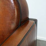 Sheepskin Art Deco design armchair with wood and beautiful cognac-colored leather