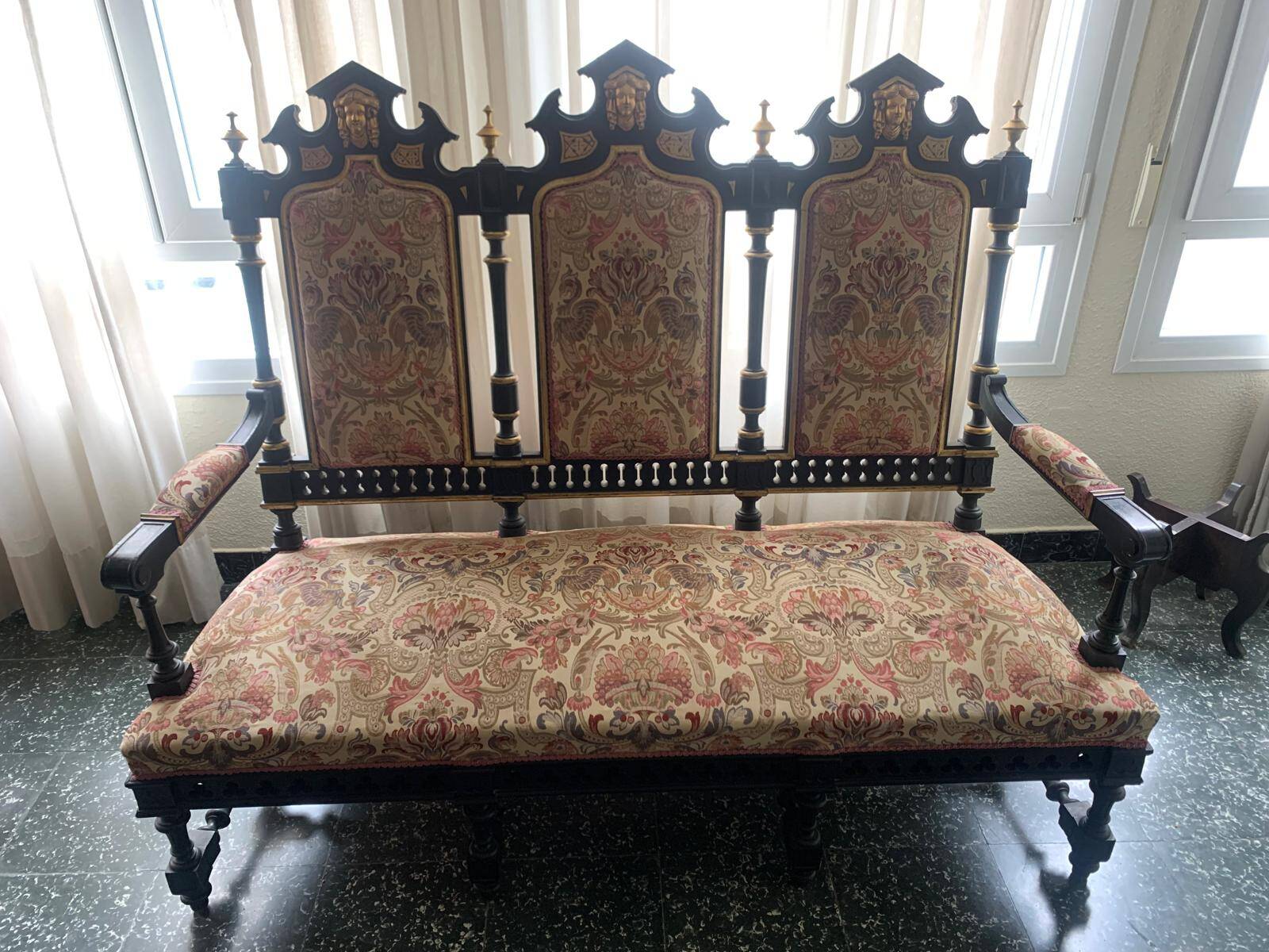 Historicist three-seater canapé in ebonised wood.