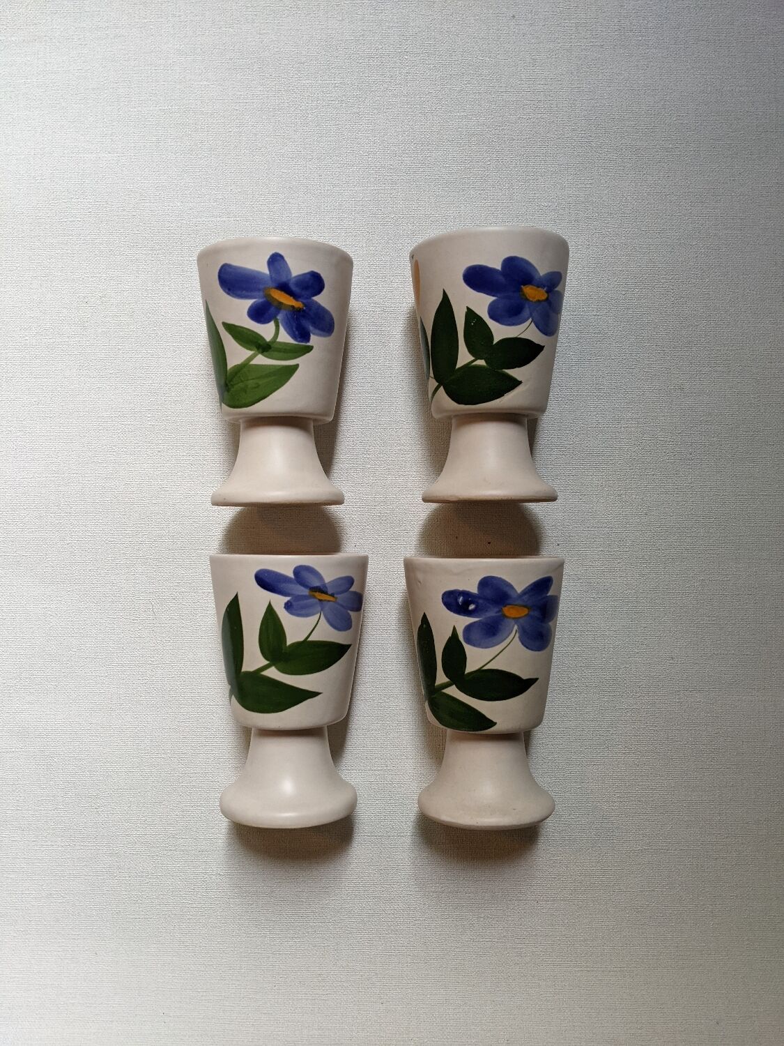 Ceramic mazagran with hand-painted floral decoration.
