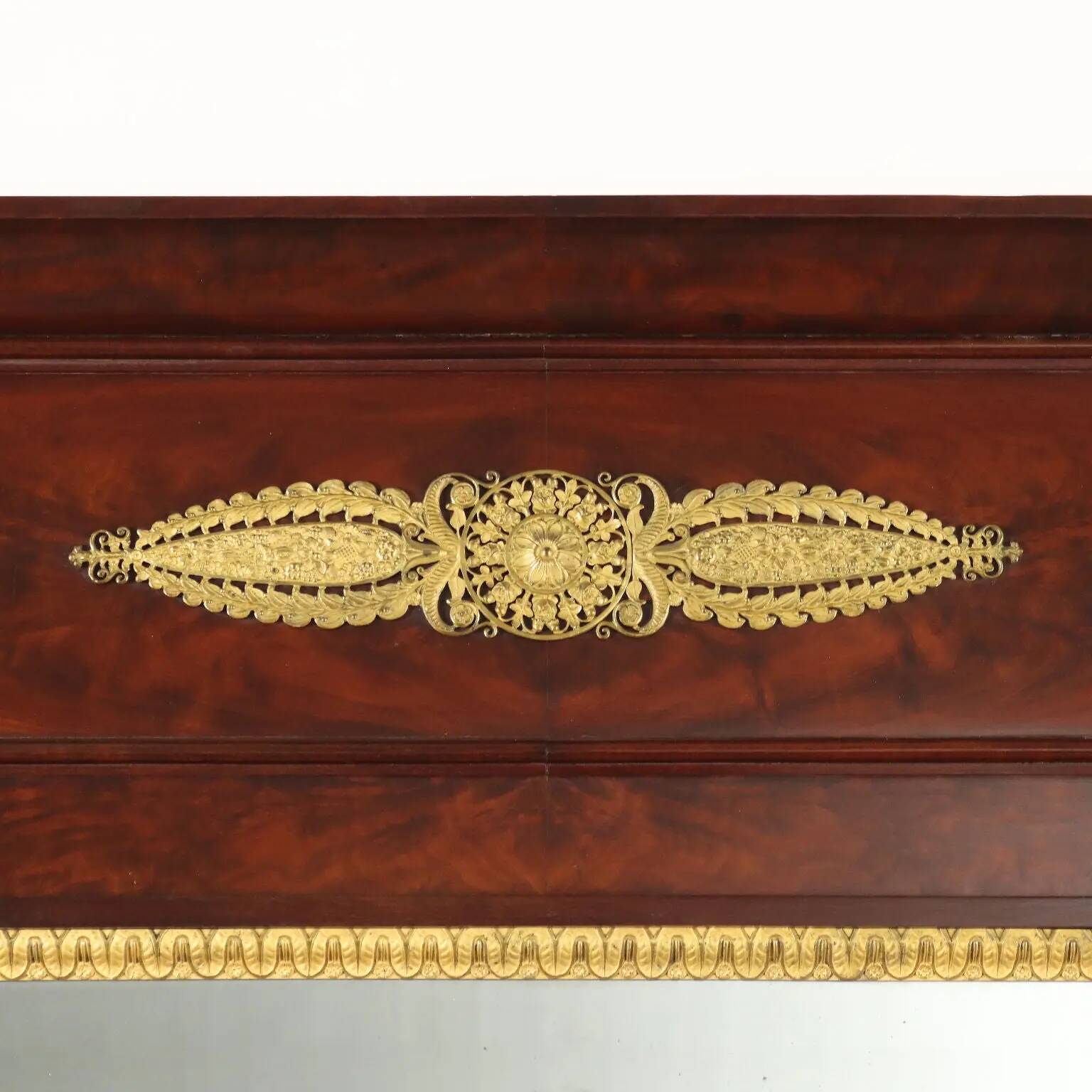 Antique Empire fireplace mirror in mahogany with a bronze frame, Italy, 19th century.