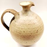 Vintage speckled brown stoneware pitcher in the shape of a ball