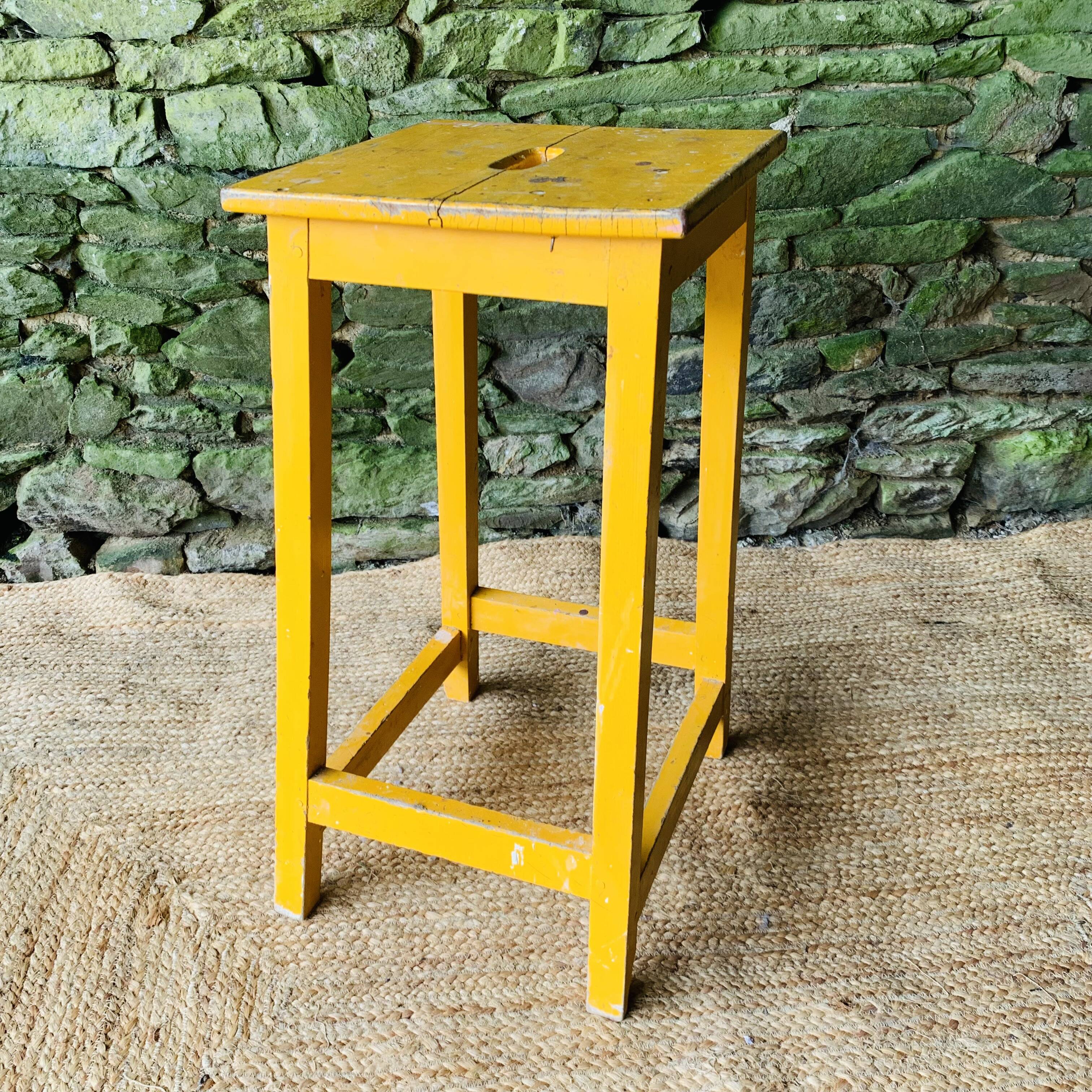 Yellow wooden high stool