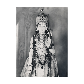 Photograph of a statue of Krishna adorned like an idol