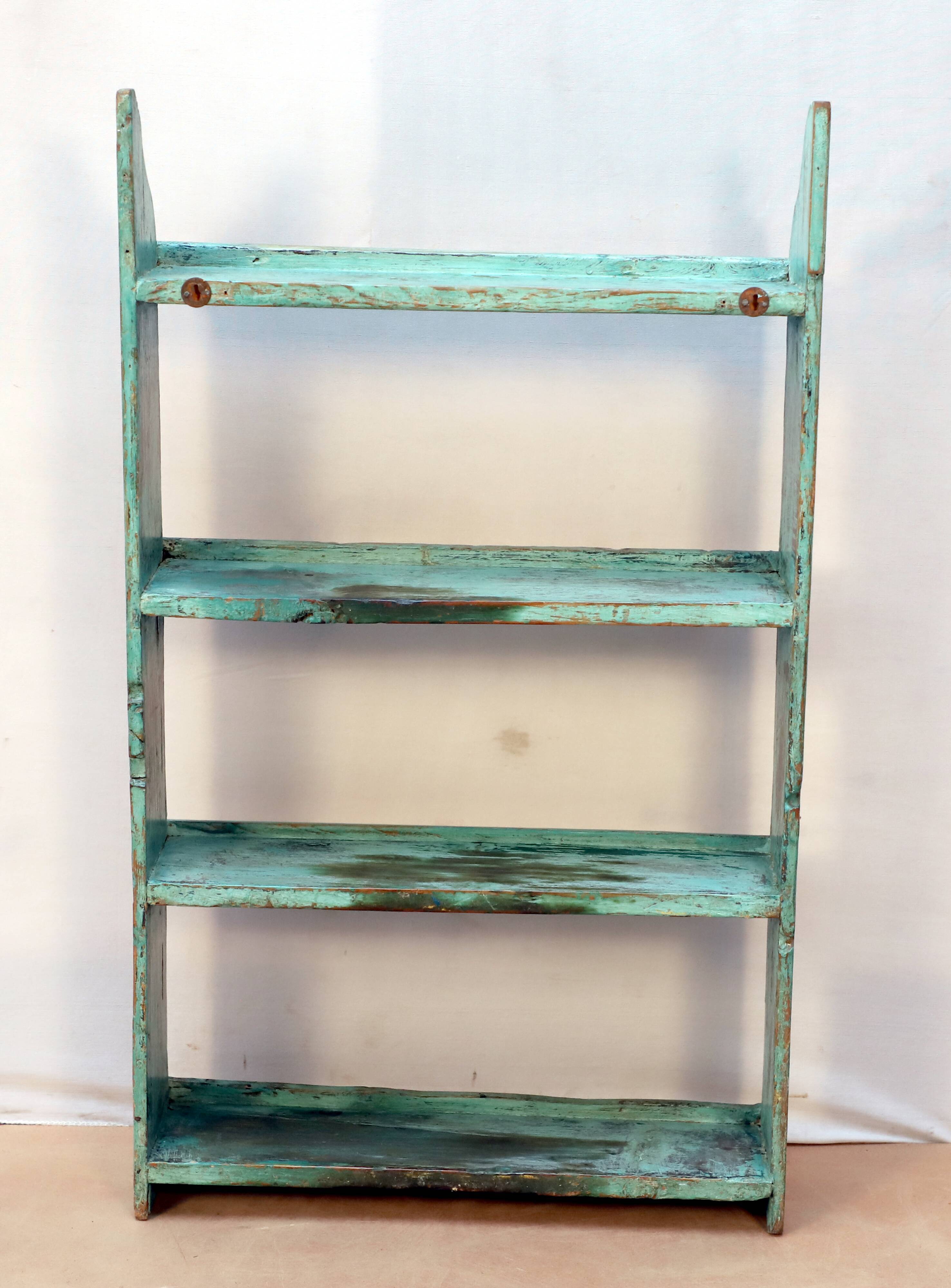 Burmese teak wall shelf with original green patina