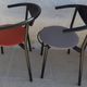 4 Gondola-style chairs with a sturdy metal frame and faux leather for