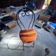 High chairs in rosewood and wrought iron