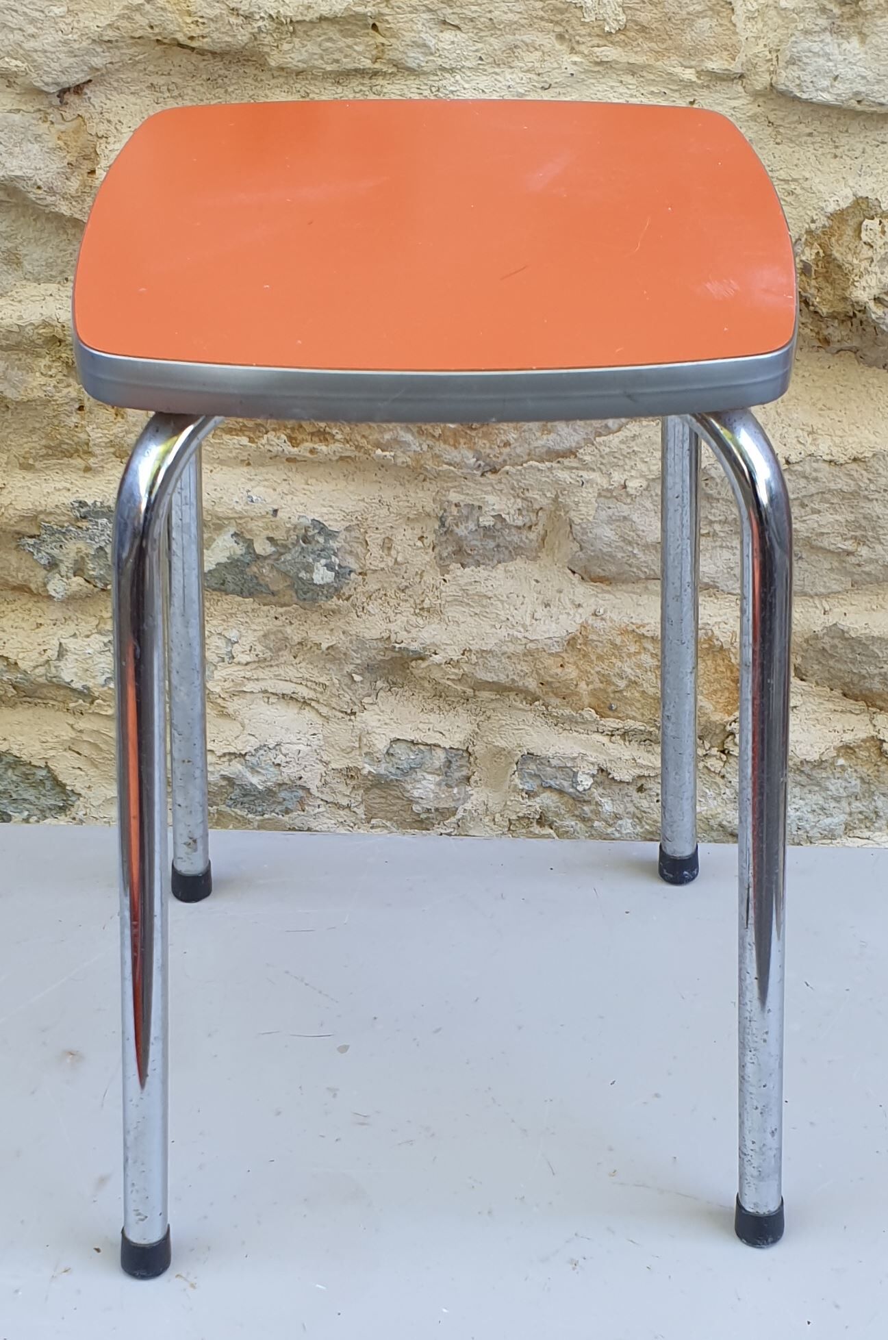 Orange formica stool