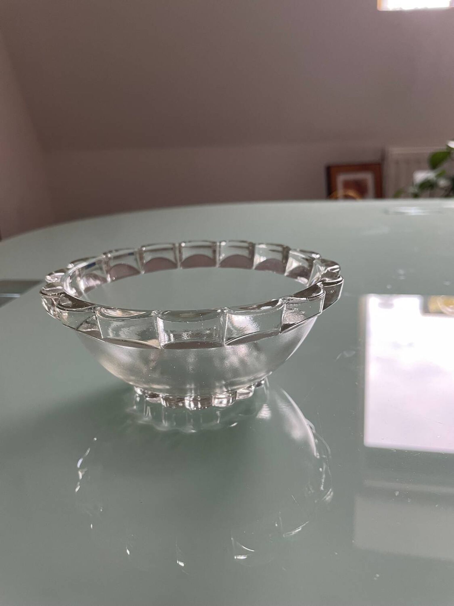 Four vintage clear glass bowls.
