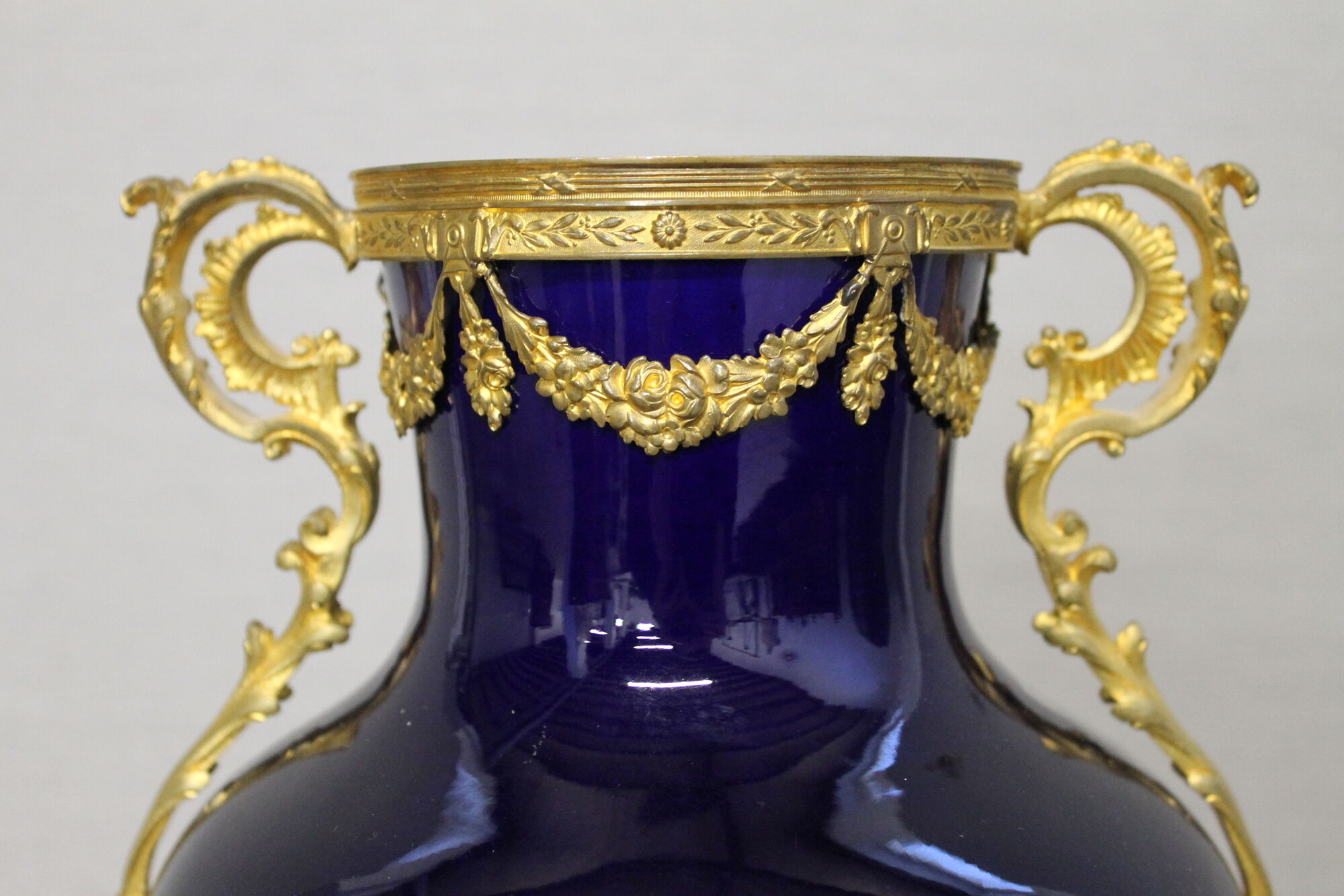 Vase signed Legastelois in blue ceramic of Sèvres and gilded bronze