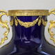 Vase signed Legastelois in blue ceramic of Sèvres and gilded bronze