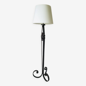 Art deco wrought iron floor lamp decorated with flowers, circa 1930.