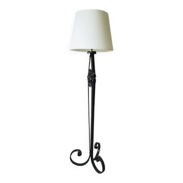 Art deco wrought iron floor lamp decorated with flowers, circa 1930.