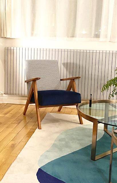 KOMPAS armchairs in grey and white.