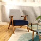 KOMPAS armchairs in grey and white.