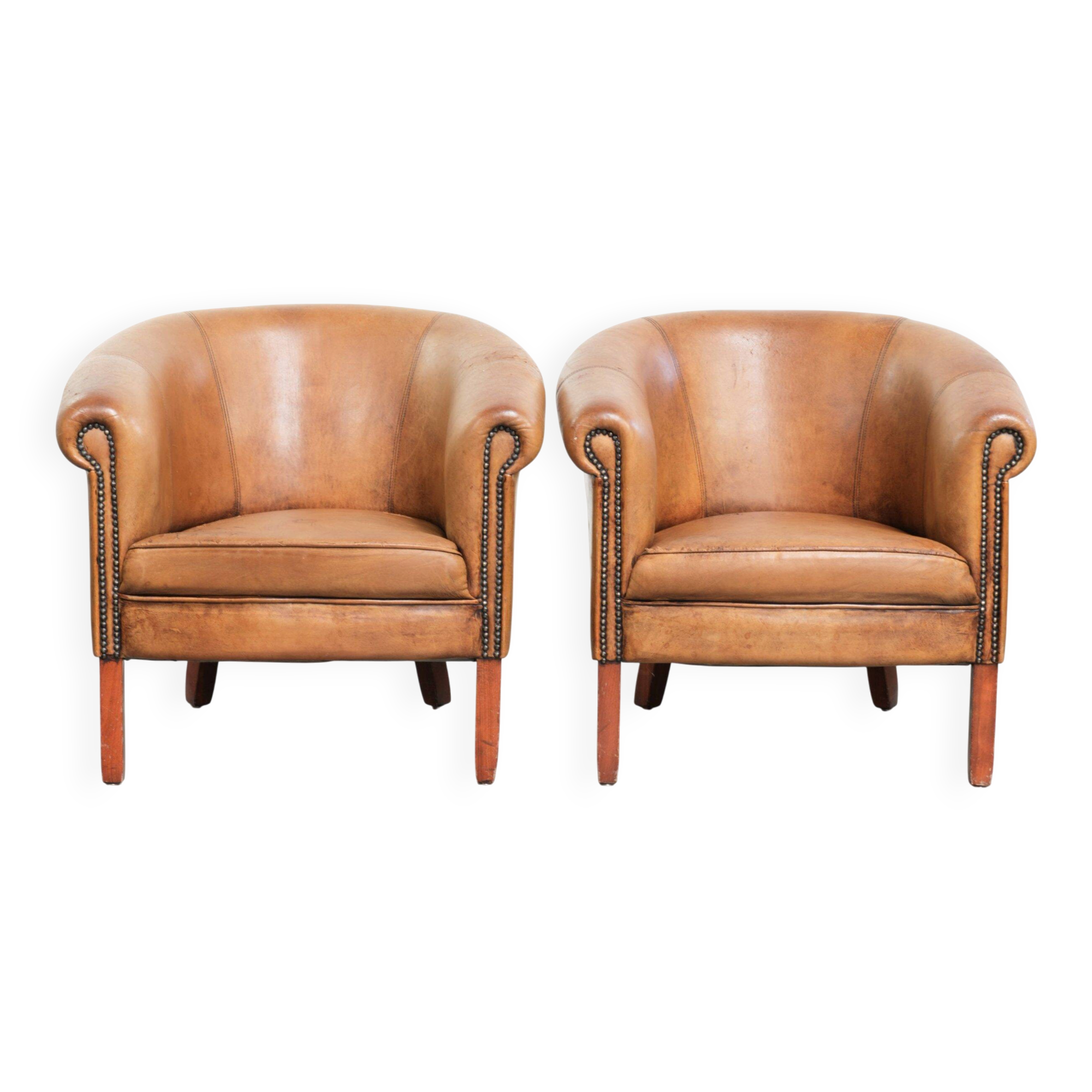 Set of two vintage sheepskin club armchairs with a beautiful light colour