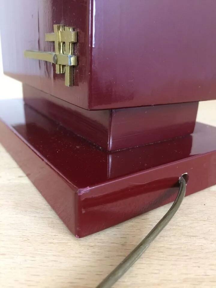 1980s vintage lamp base in red wood and gold metal.