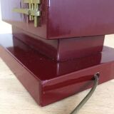 1980s vintage lamp base in red wood and gold metal.