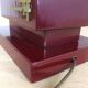 1980s vintage lamp base in red wood and gold metal.