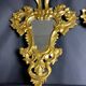Pair of carved and gilded wooden mirrors, Italian Baroque style, 19th century.