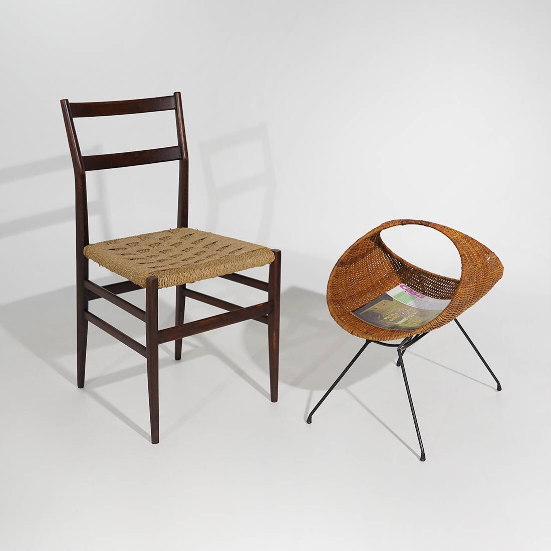 Rattan magazine rack with metal legs, 1950s