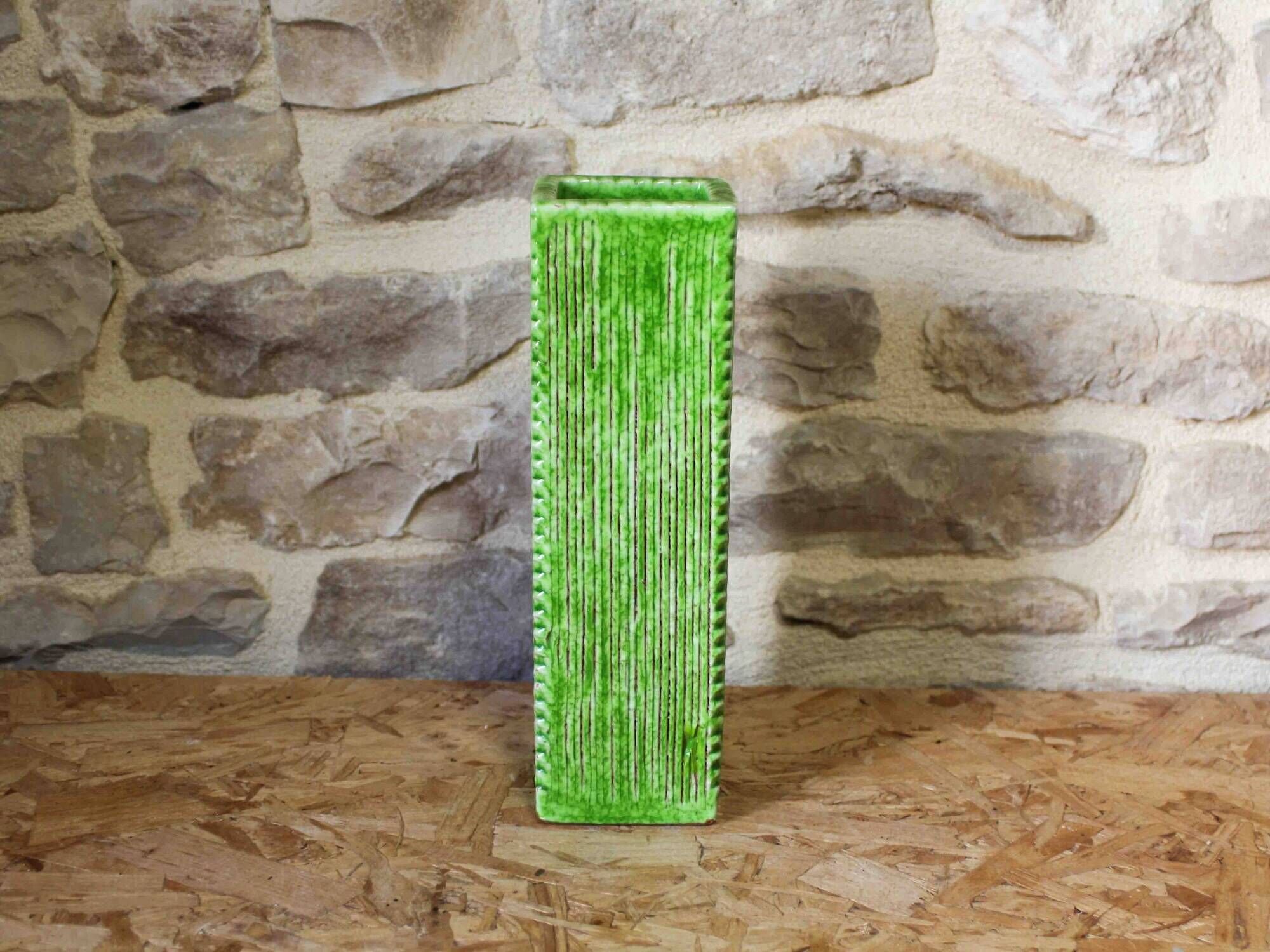 Incised ceramic vase with a square section