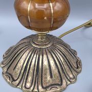 Hollywood Regency bedside lamp in gold metal with a glass globe.