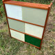 Vintage 1960s display shelf with sliding glass doors.
