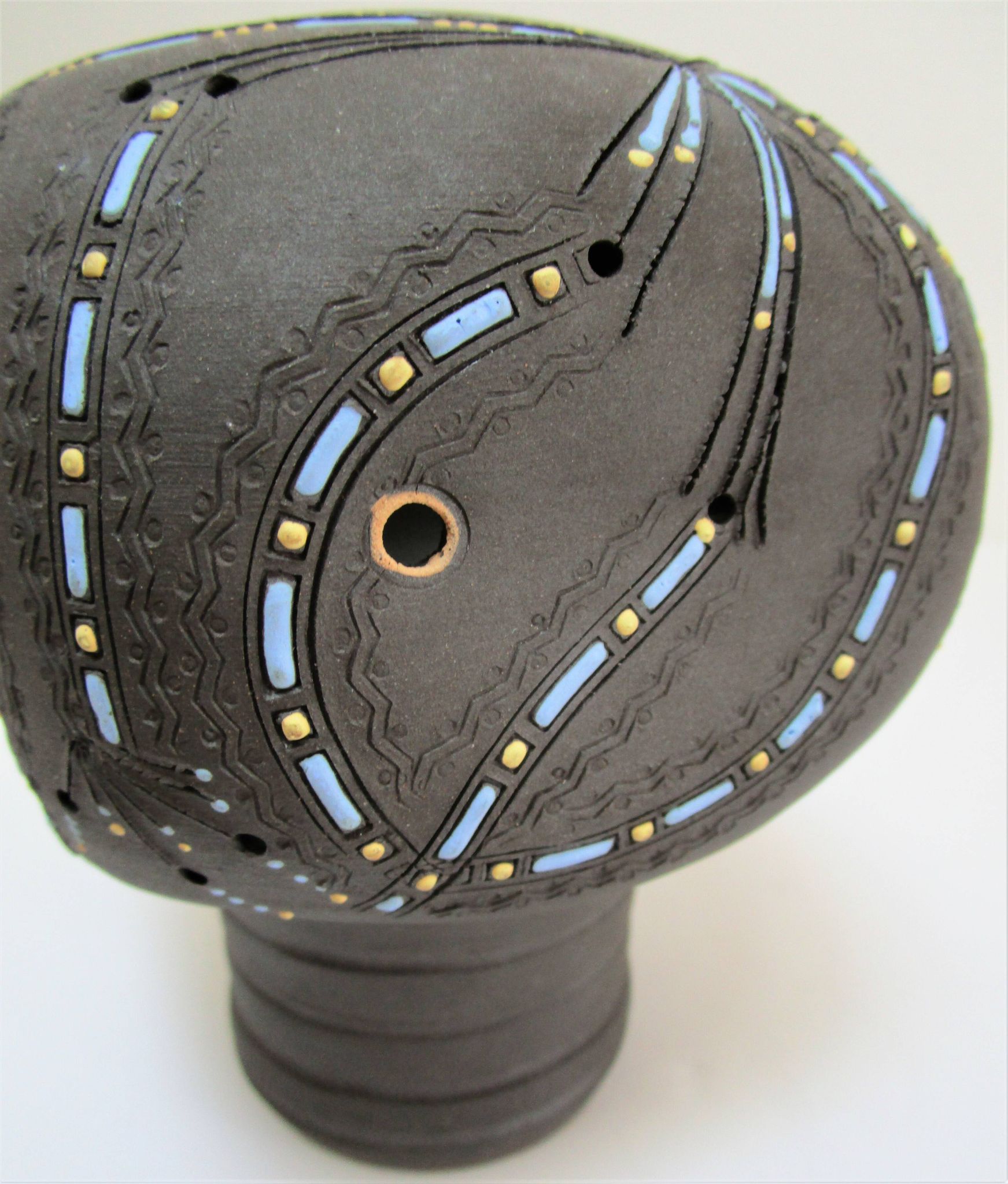 Anthropomorphic candle holder, scarified ceramic, stamped design