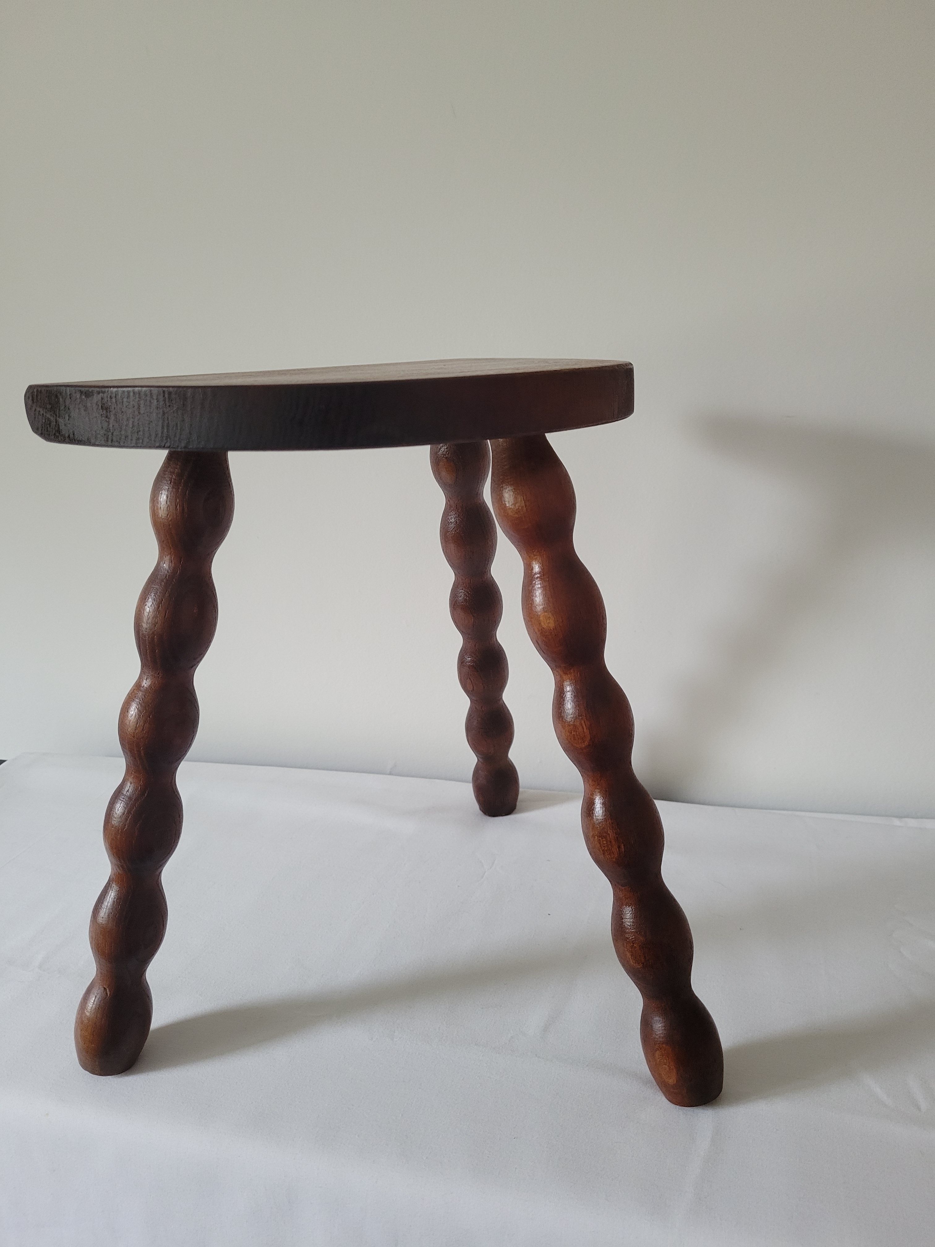 Brutalist stool turned wooden feet
