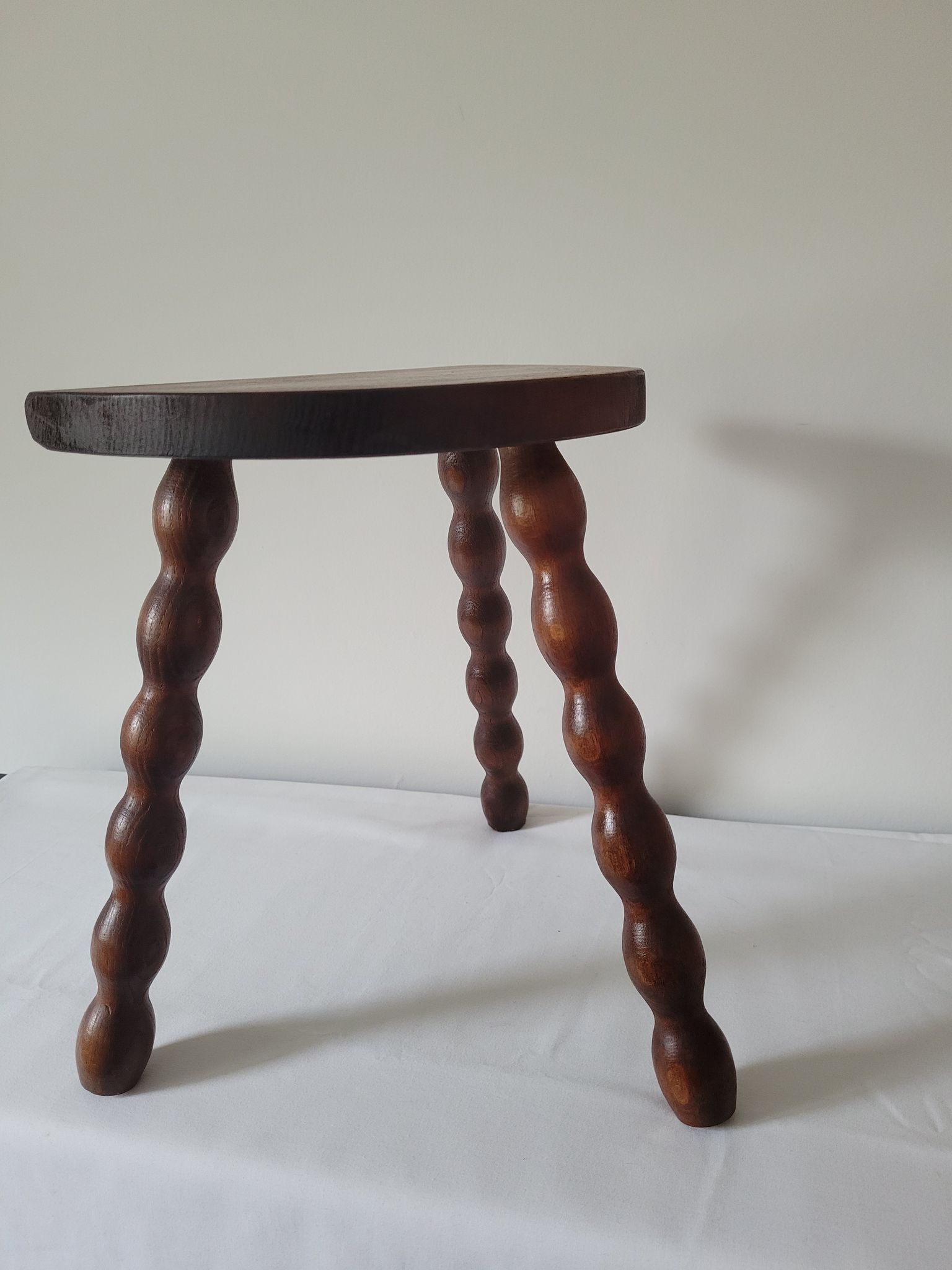 Brutalist stool turned wooden feet