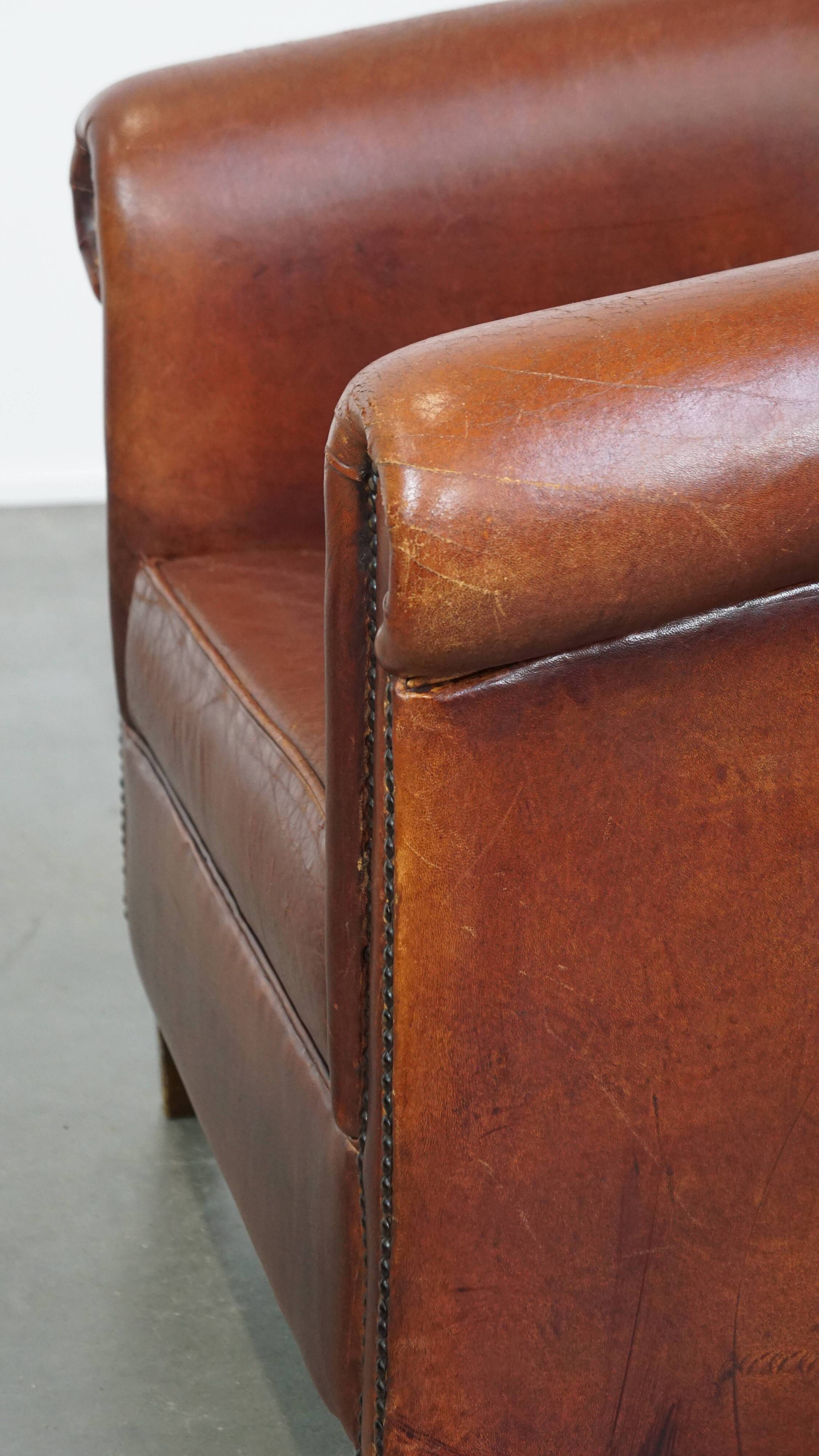English style sheepskin club chair with a beautiful patina