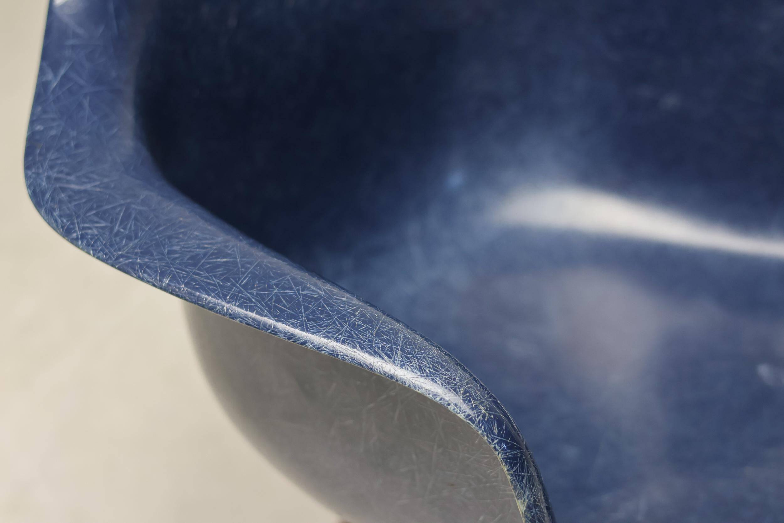 Indigo blue Charles Eames "PAW" armchair by Herman Miller, mid-century modern.