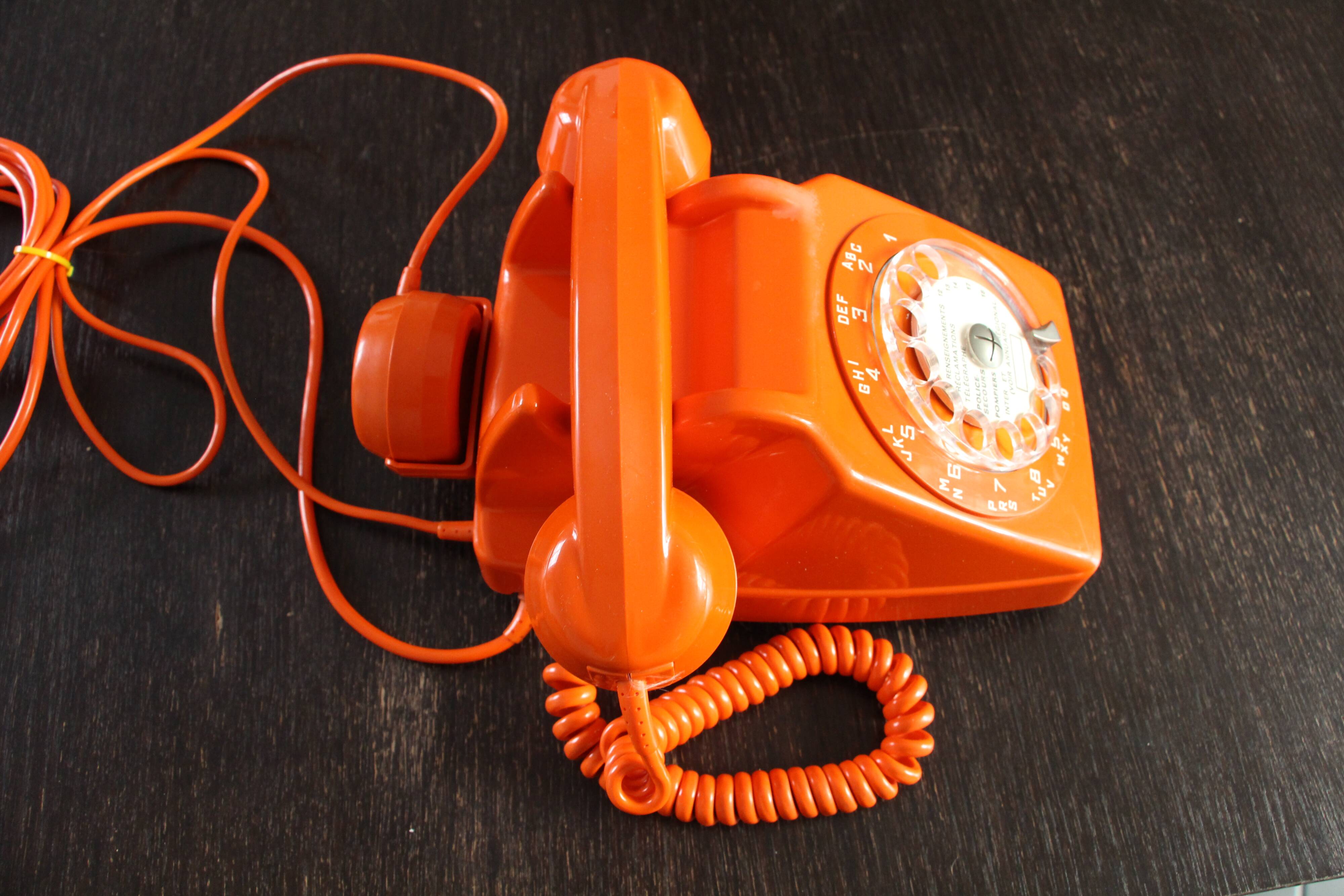 Vintage phone with orange dial 70's