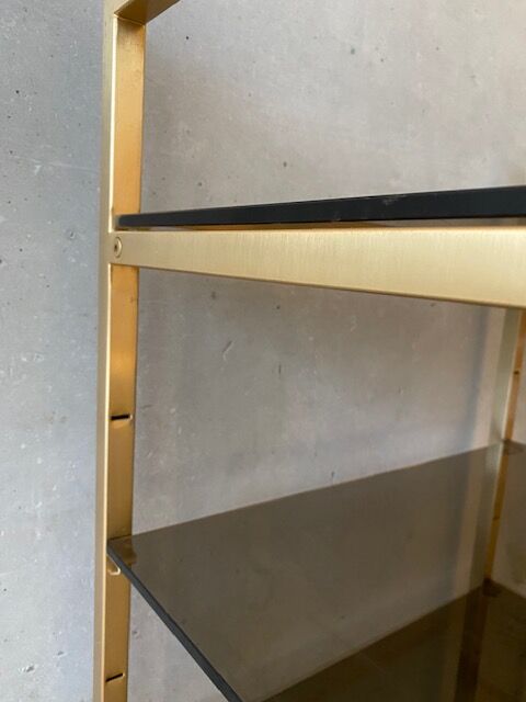 Golden brass and glass shelves
