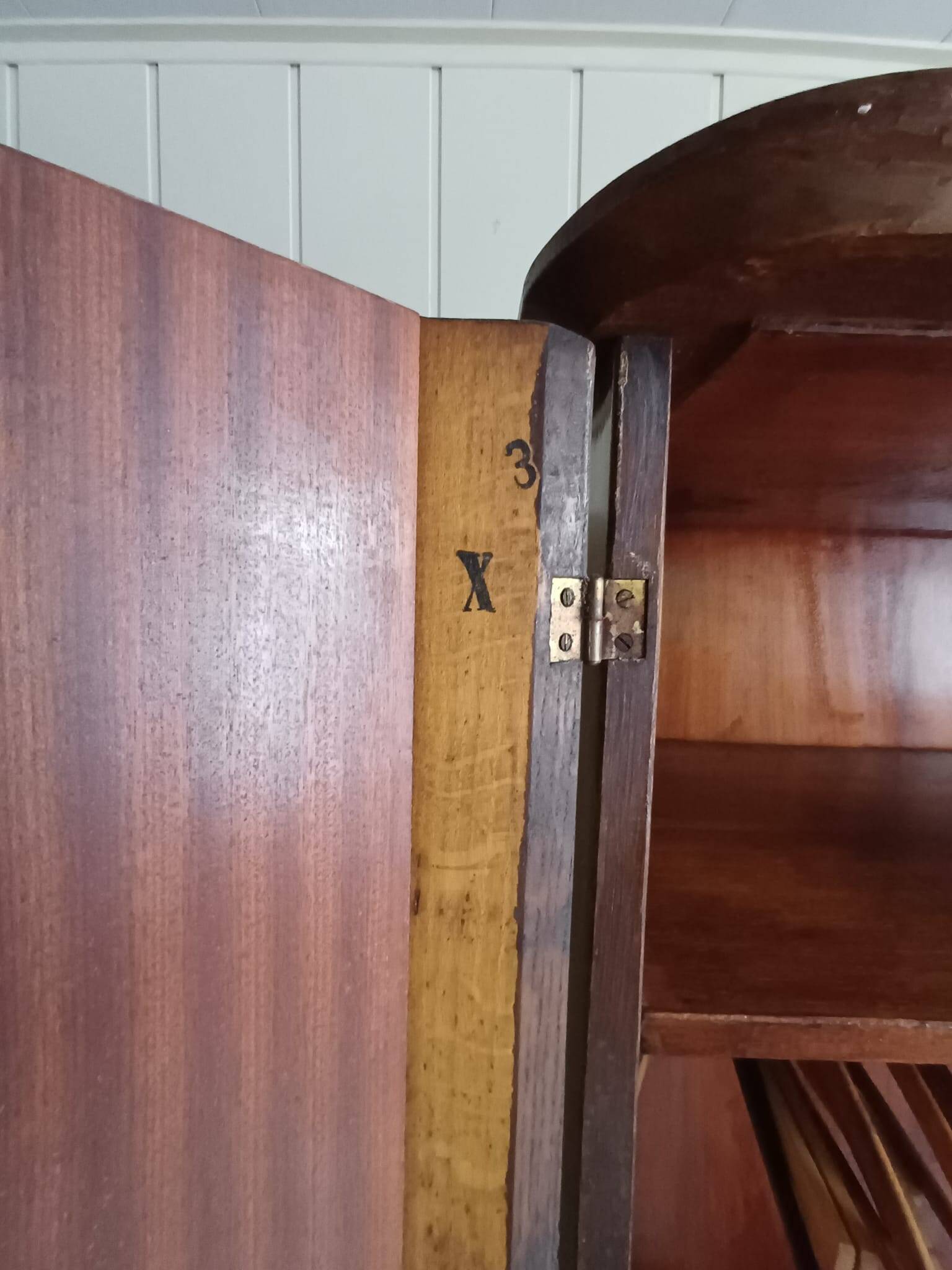 Vintage 1960s wooden wardrobe with a central mirror and tapered legs.