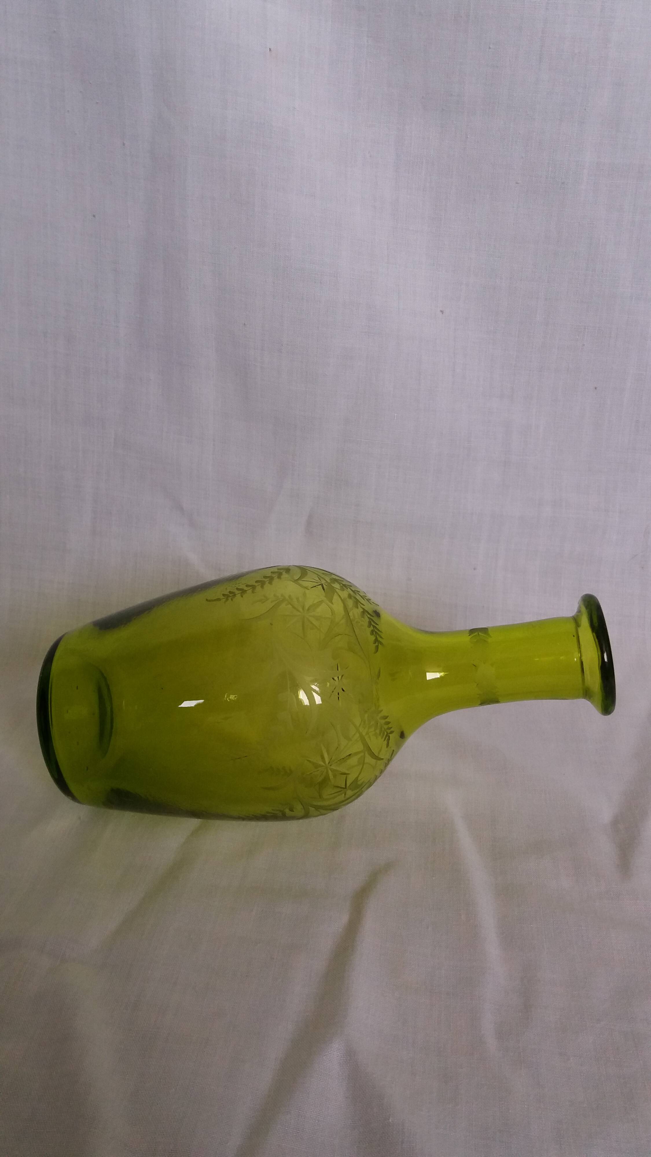 Cut and engraved green blown glass carafe vase