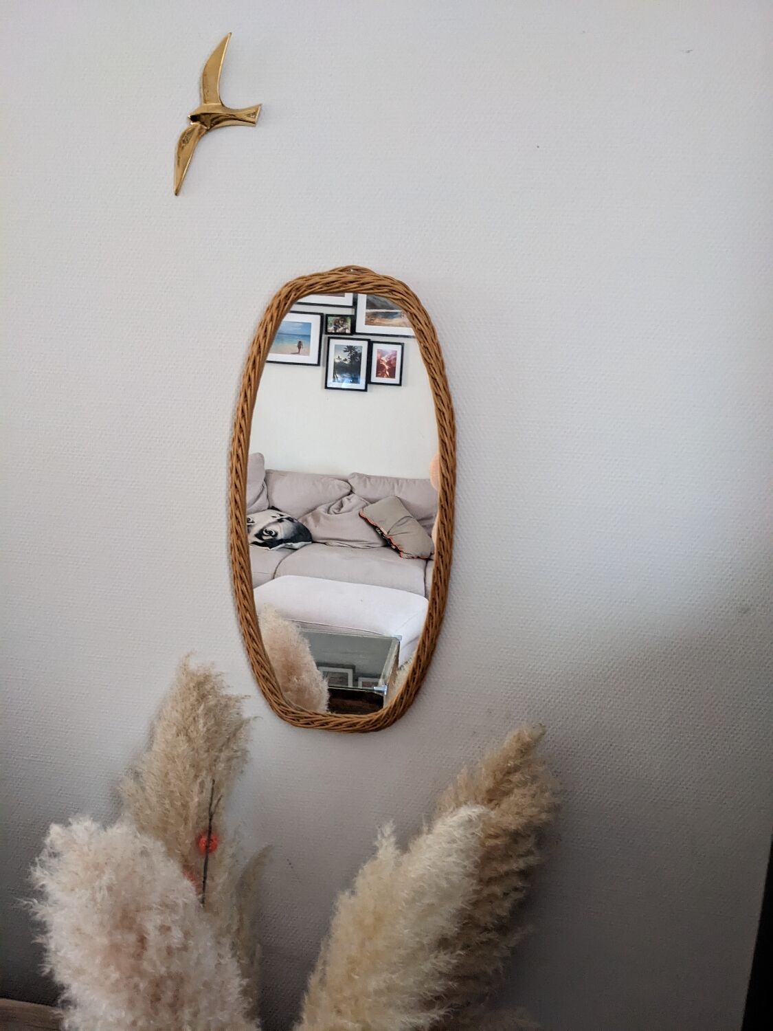 Vintage oval rattan mirror