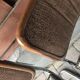 Set of 4 Mid-Century brown faux leather chairs with wood and chrome structure (1970s)