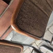 Set of 4 Mid-Century brown faux leather chairs with wood and chrome structure (1970s)